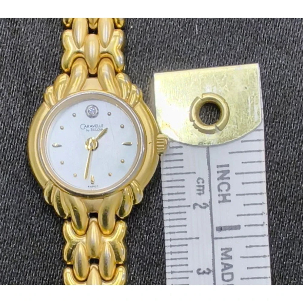 Caravelle by Bulova 44P07 women's Watch Gold Tone Round White Face #W5153